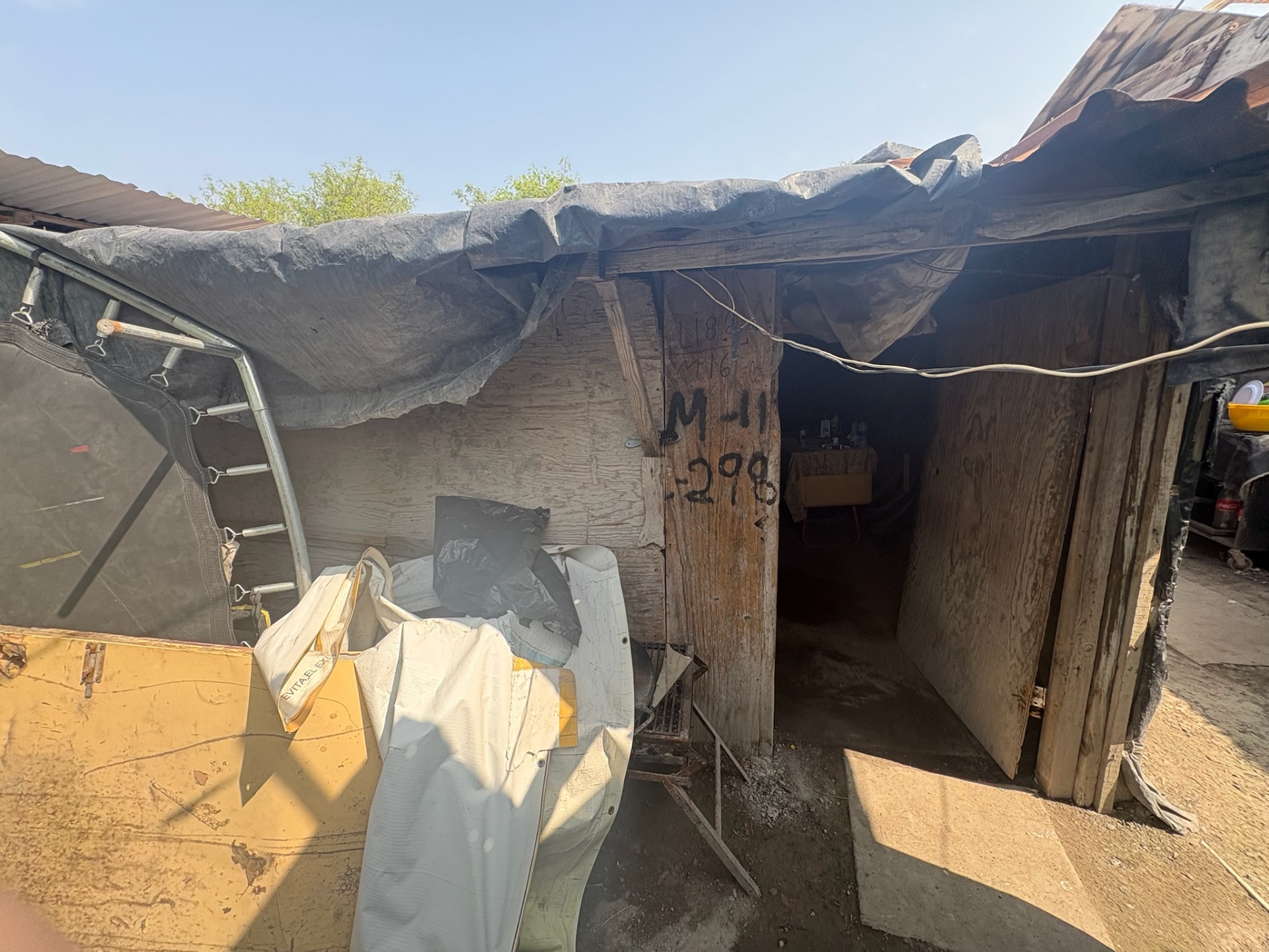 Family home before Casa De David's work — a makeshift shelter